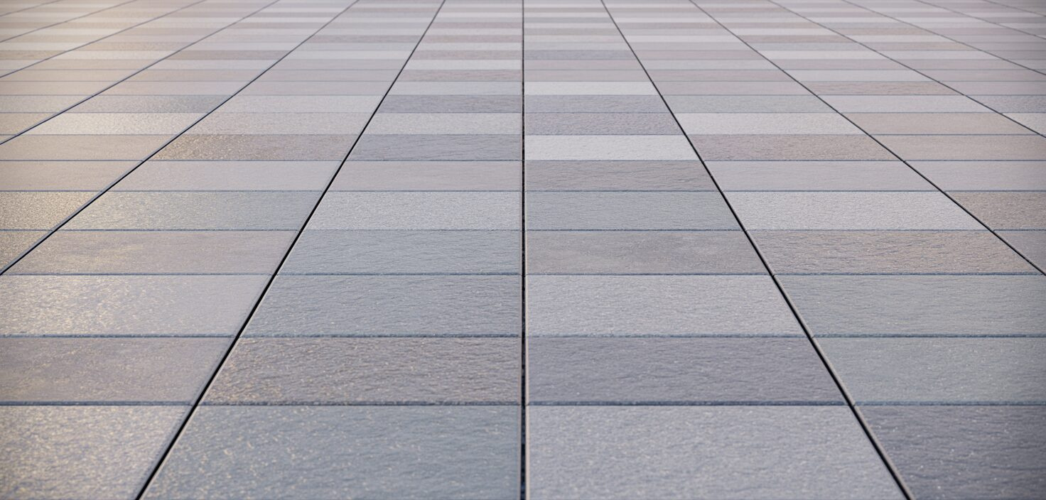 Minimalistinen terassi graniittikivillä, auringonvalossa.